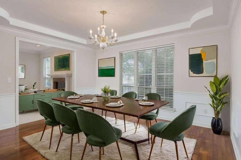 Virtual staging with a wooden dining table and green upholstered chairs