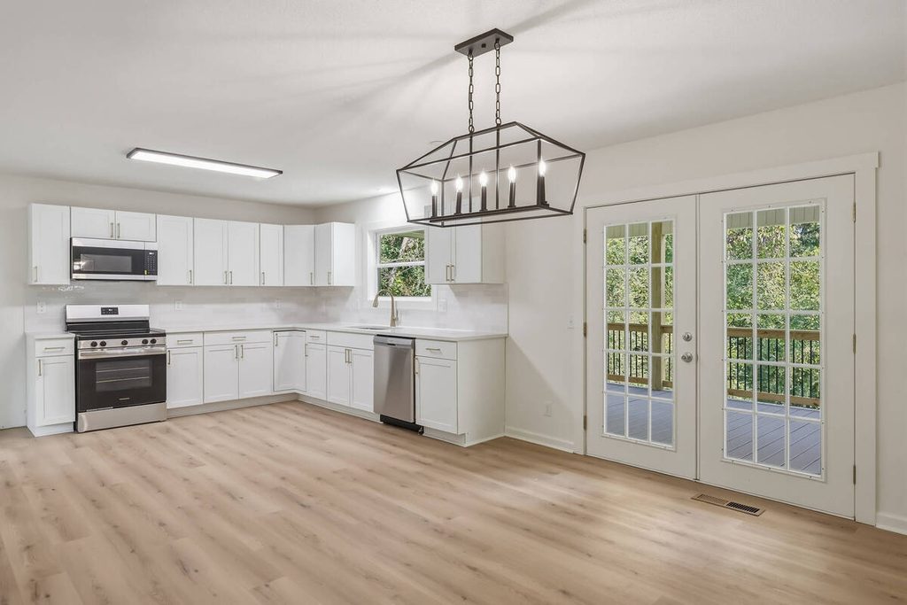 Empty kitchen and dining area before virtual staging