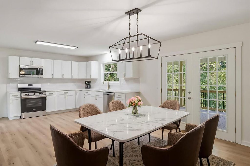 Virtual staging with a marble dining table and contemporary chairs