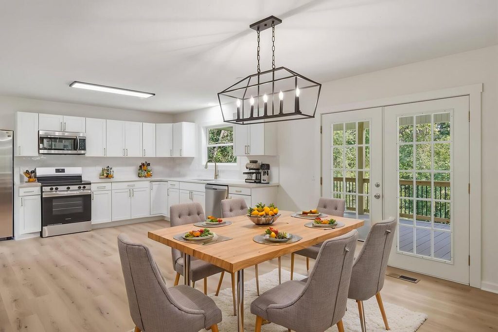 Virtual staging featuring a wooden table and upholstered dining chairs