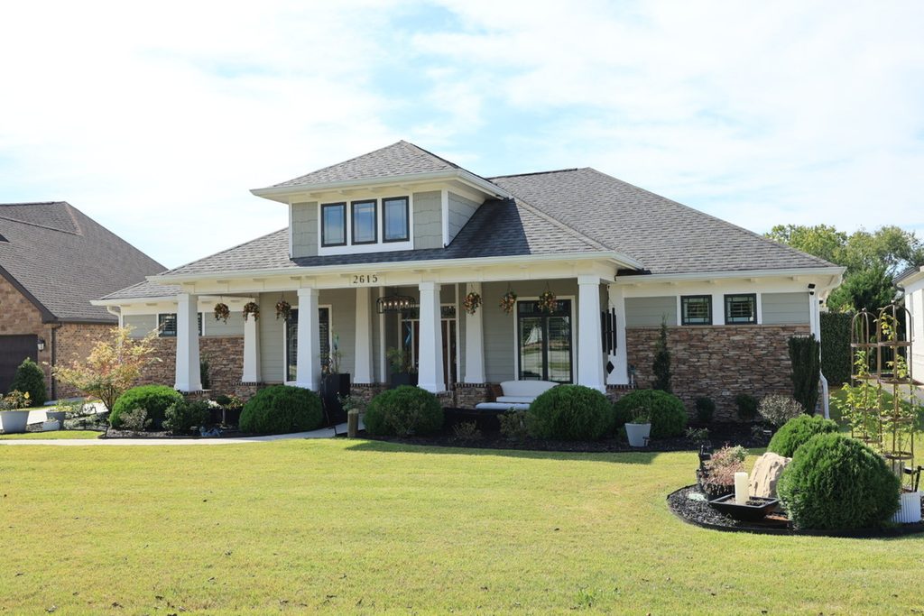 Original residential exterior photo with a pale sky before AI sky replacement