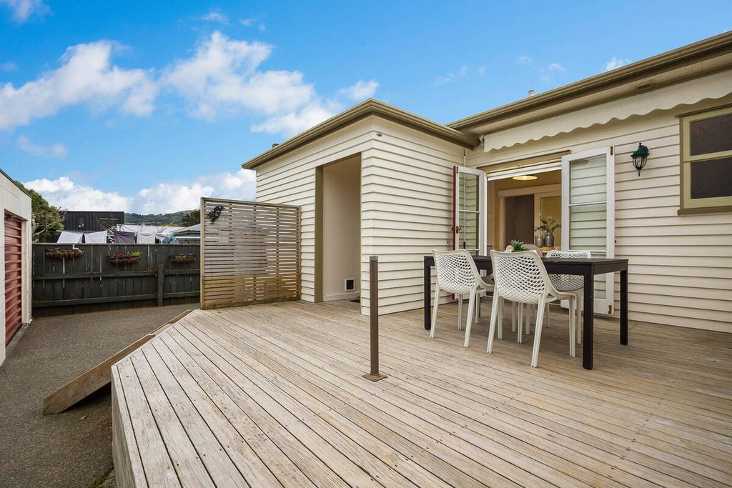 AI sky replacement creates a blue sky above an outdoor wooden patio