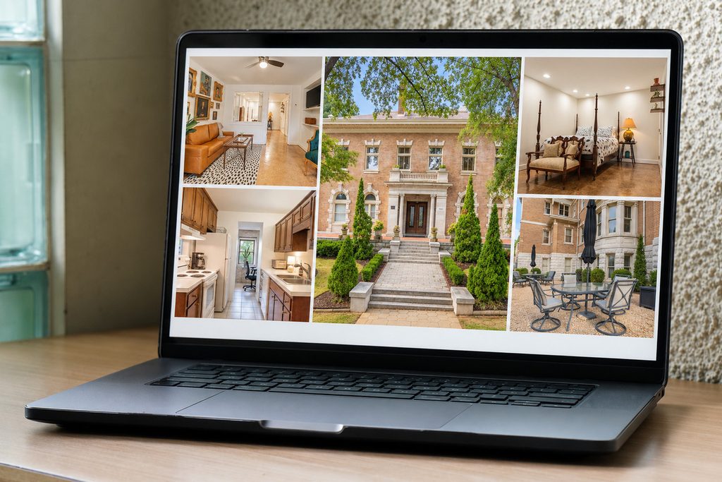 Laptop displaying a real estate property gallery.