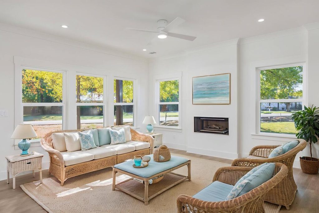 Coastal-style living room with wicker seating.