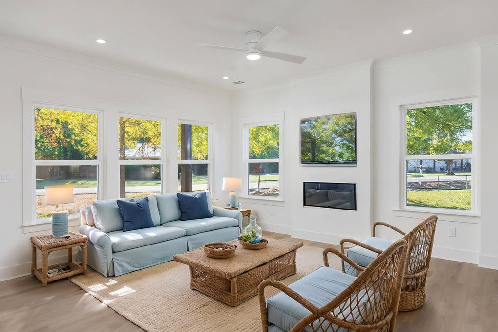 Virtually staged living room with blue sofa.