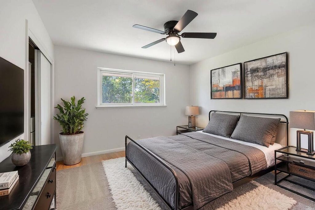 Staged bedroom with gray bedding.