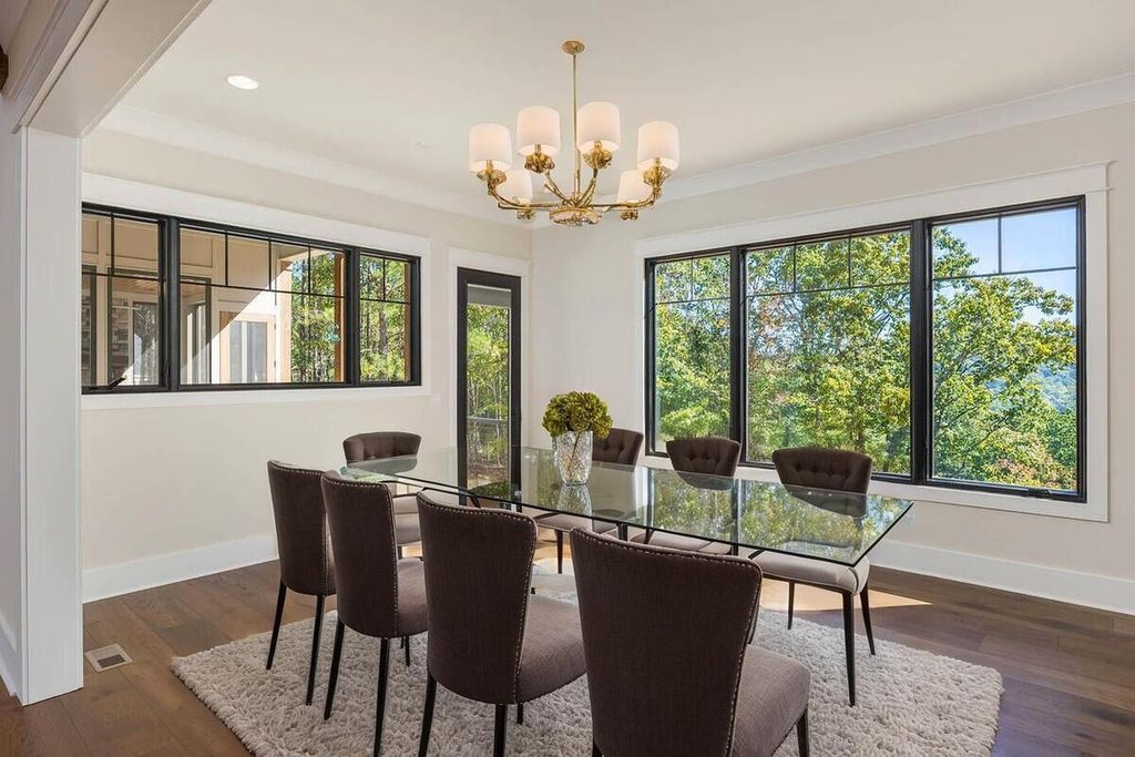 Elegant dining room with glass table.