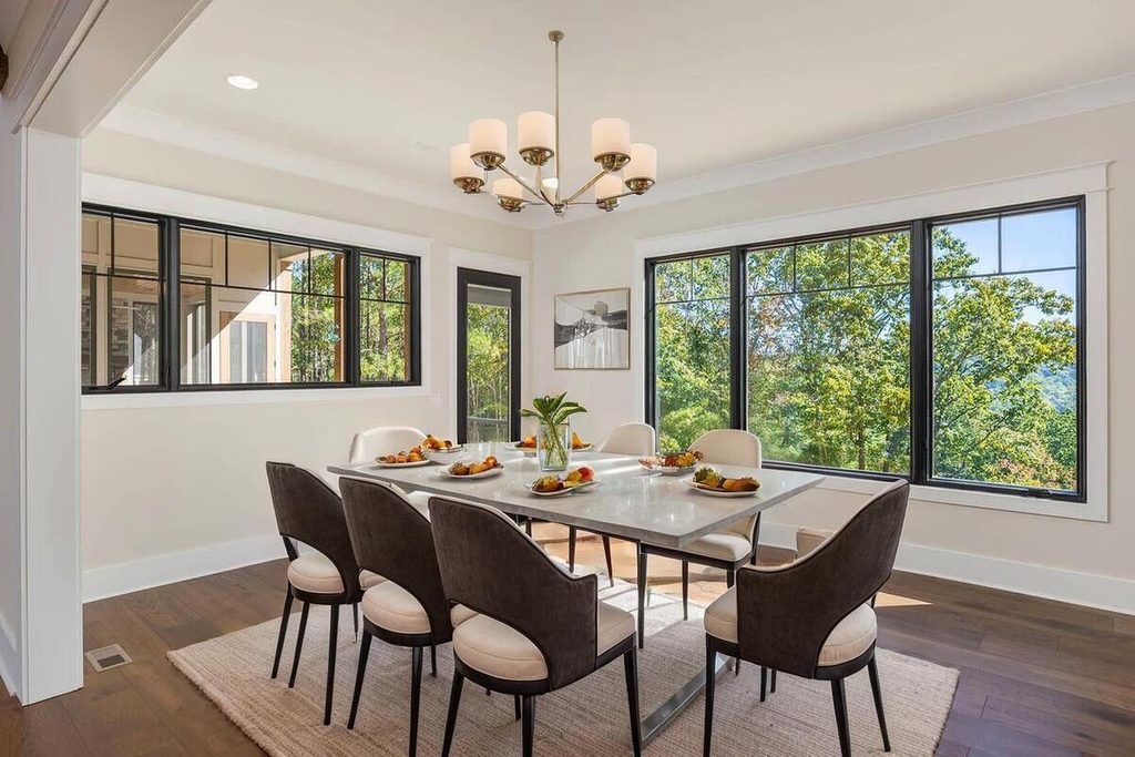 Modern dining room with white table.