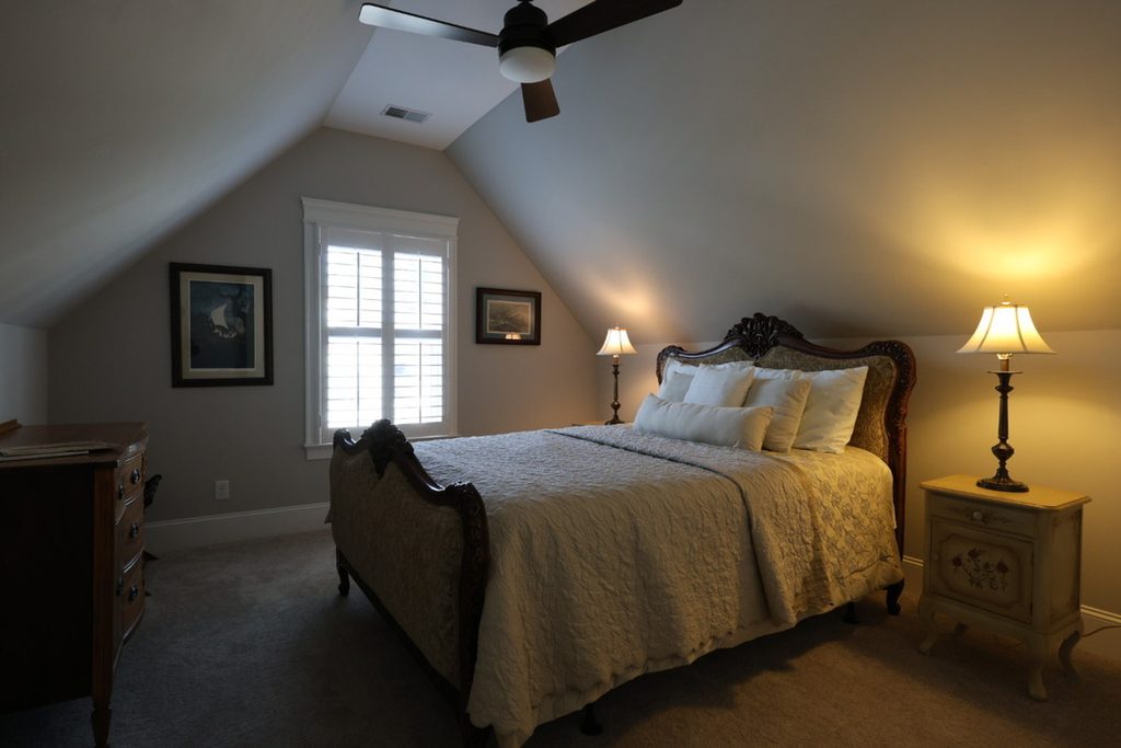 Dark bedroom before AI exposure correction