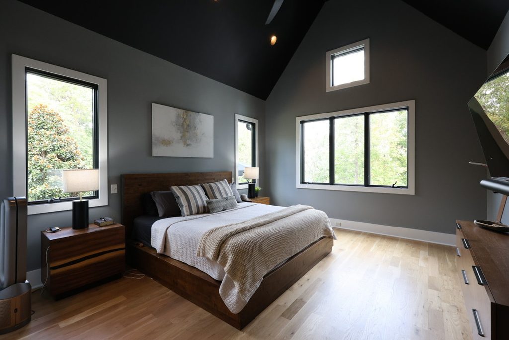 Dark bedroom before AI exposure correction