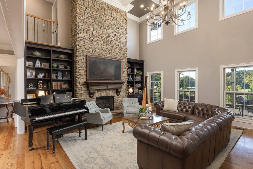 AI exposure correction in a luxury living room with a stone fireplace